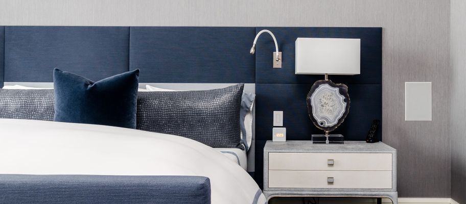 Bed with large blue headboard