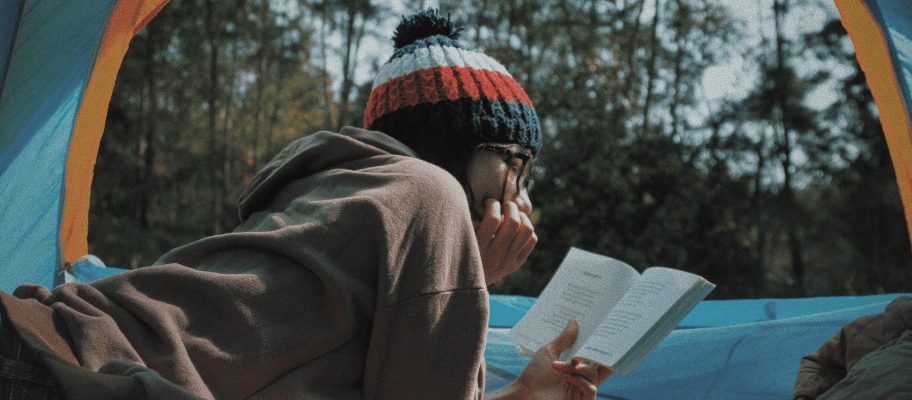 Woman Reading In Tent